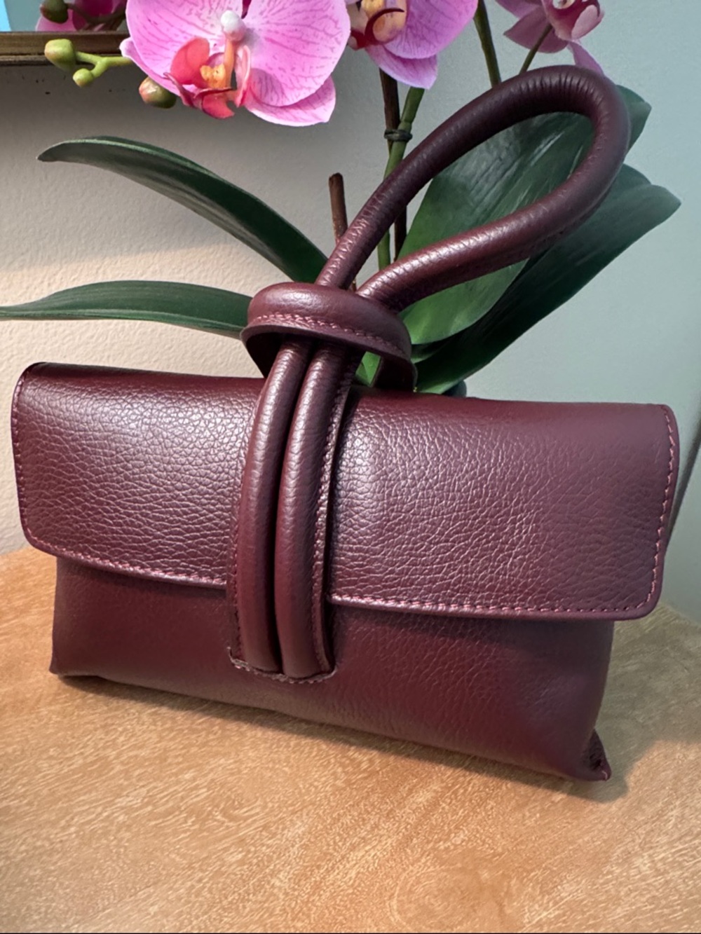 Italian leather clutch in wine color. NWT